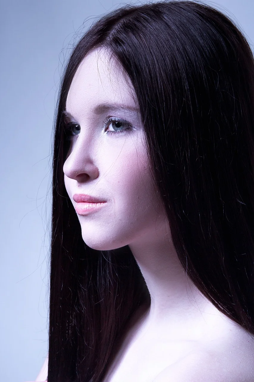 mystical portrait of a girl, eyes, black background, young woman