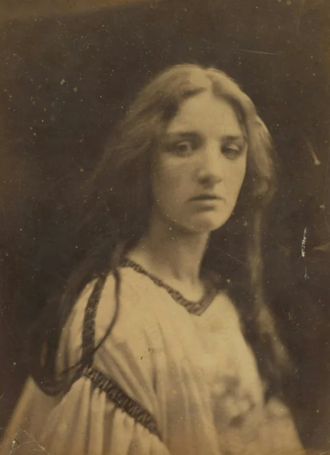 A vintage portrait of a woman with long hair