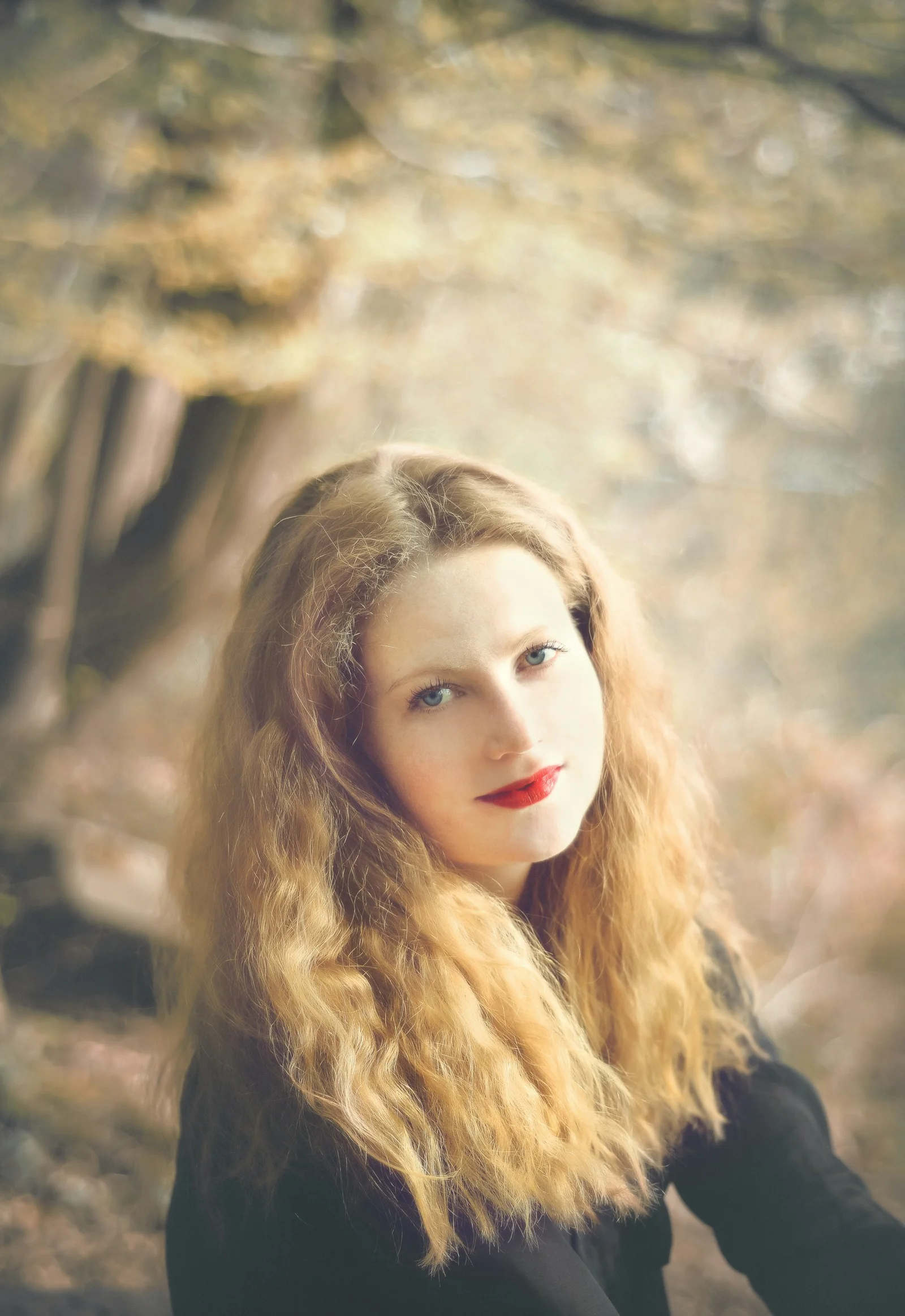woman smiling near trees