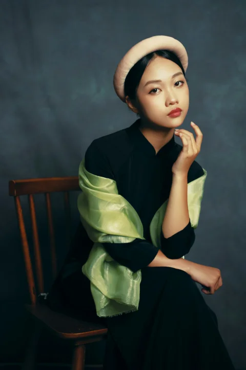 Young woman in traditional vietnamese ao dai and headpiece