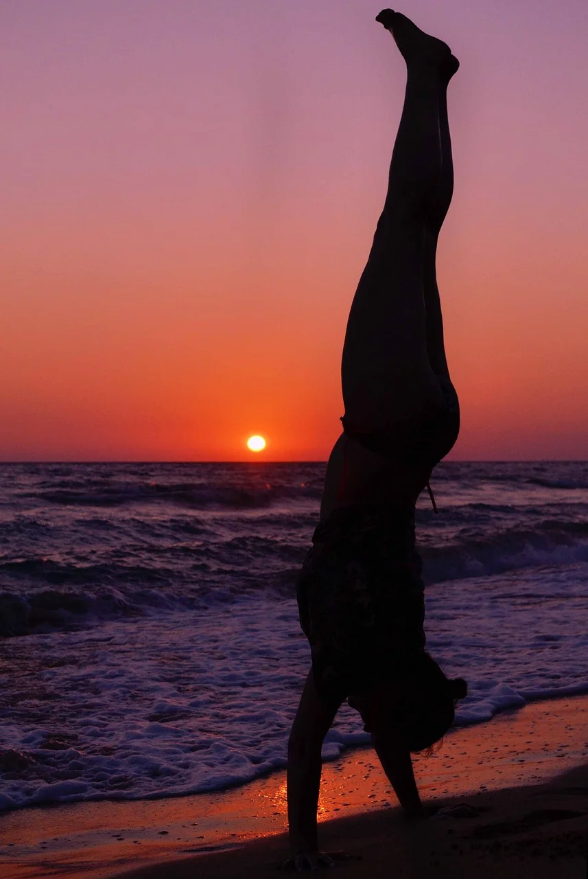 woman silhouette standing on hands, sunset beach seascape, landscape, sivota