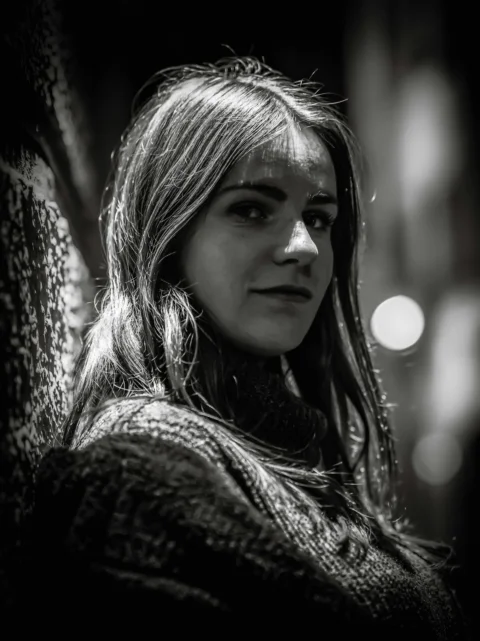 Young woman with long hair wearing a sweater