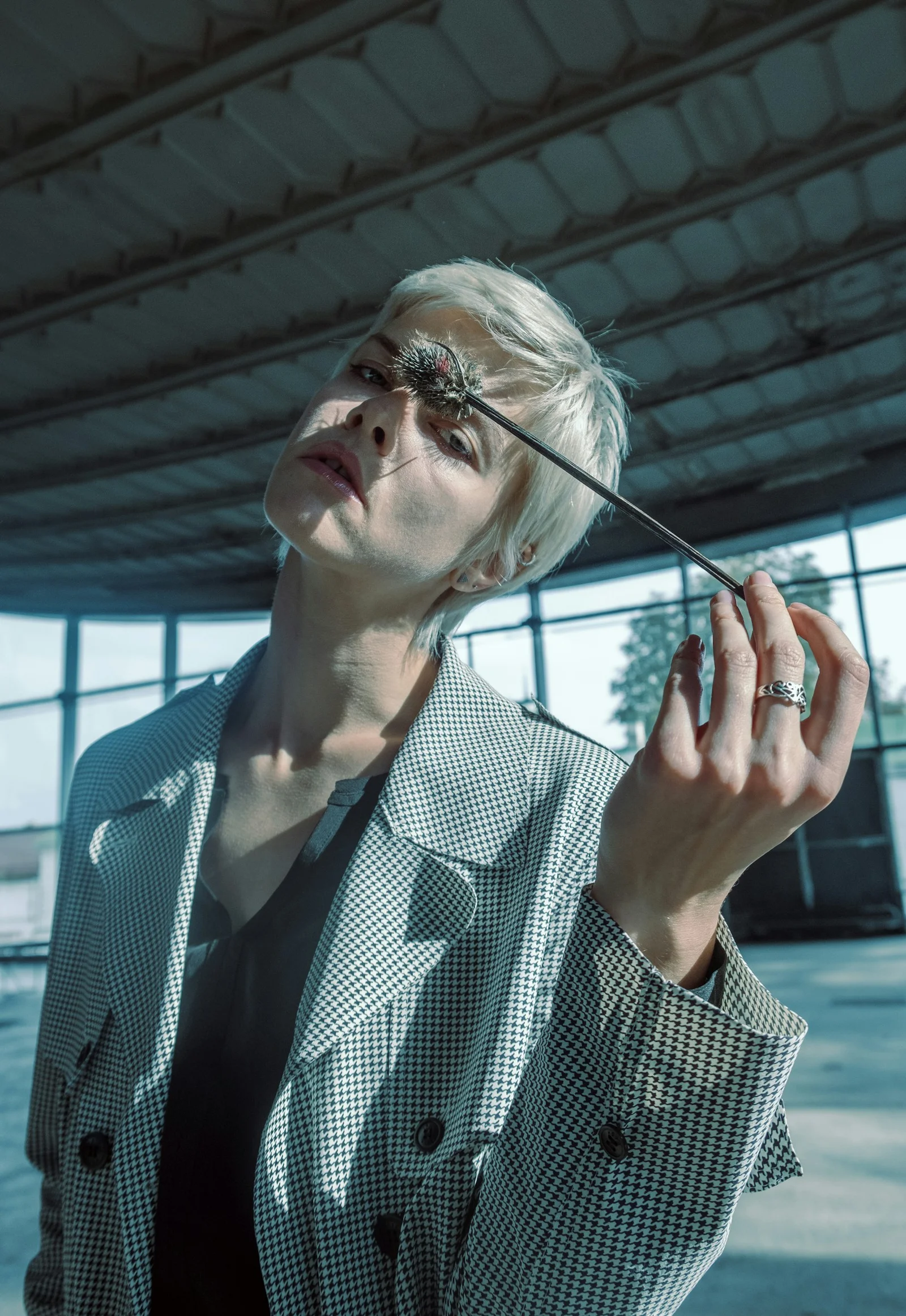 woman in white and black checkered button up shirt wearing sunglasses