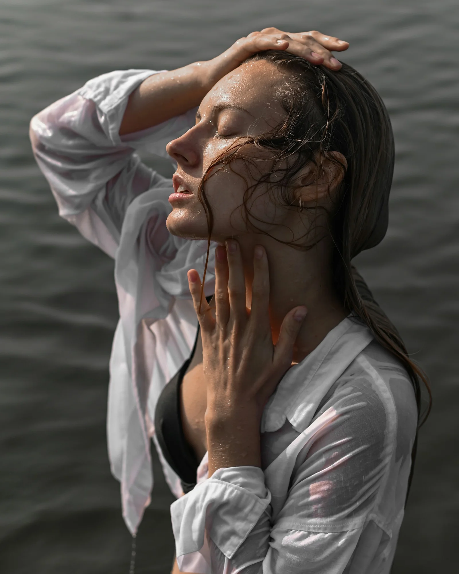 a person with the hands on the face