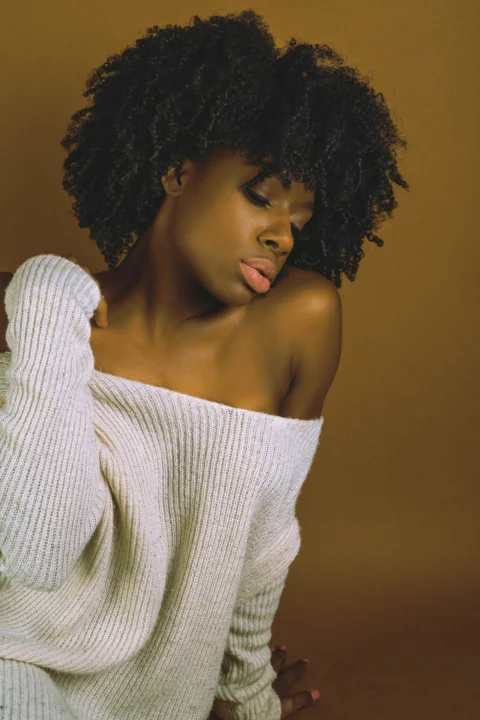 Beautiful woman in off-the-shoulder sweater