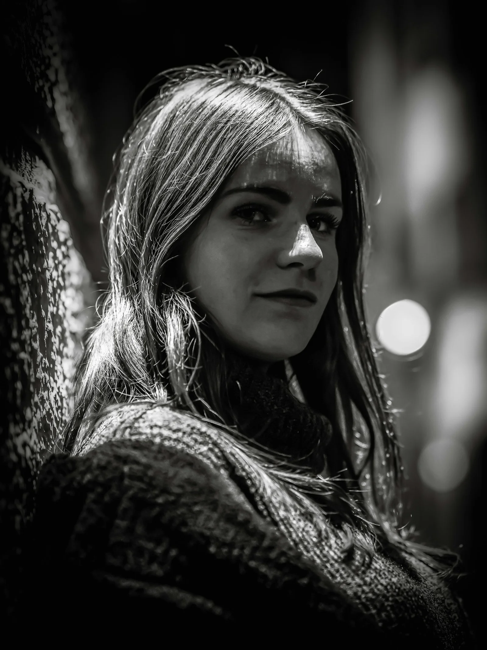 Young woman with long hair wearing a sweater