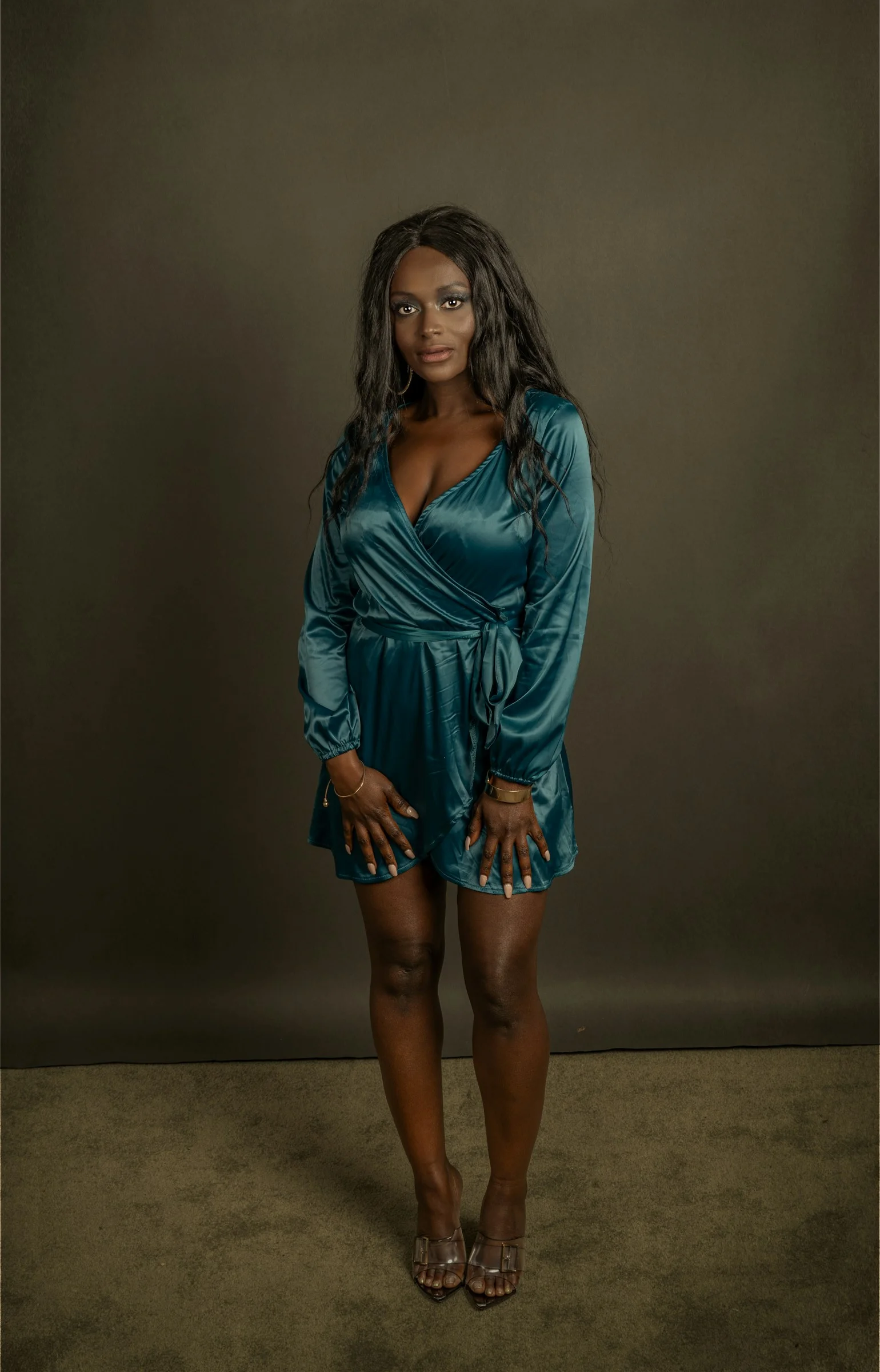a woman in a blue dress posing for a picture