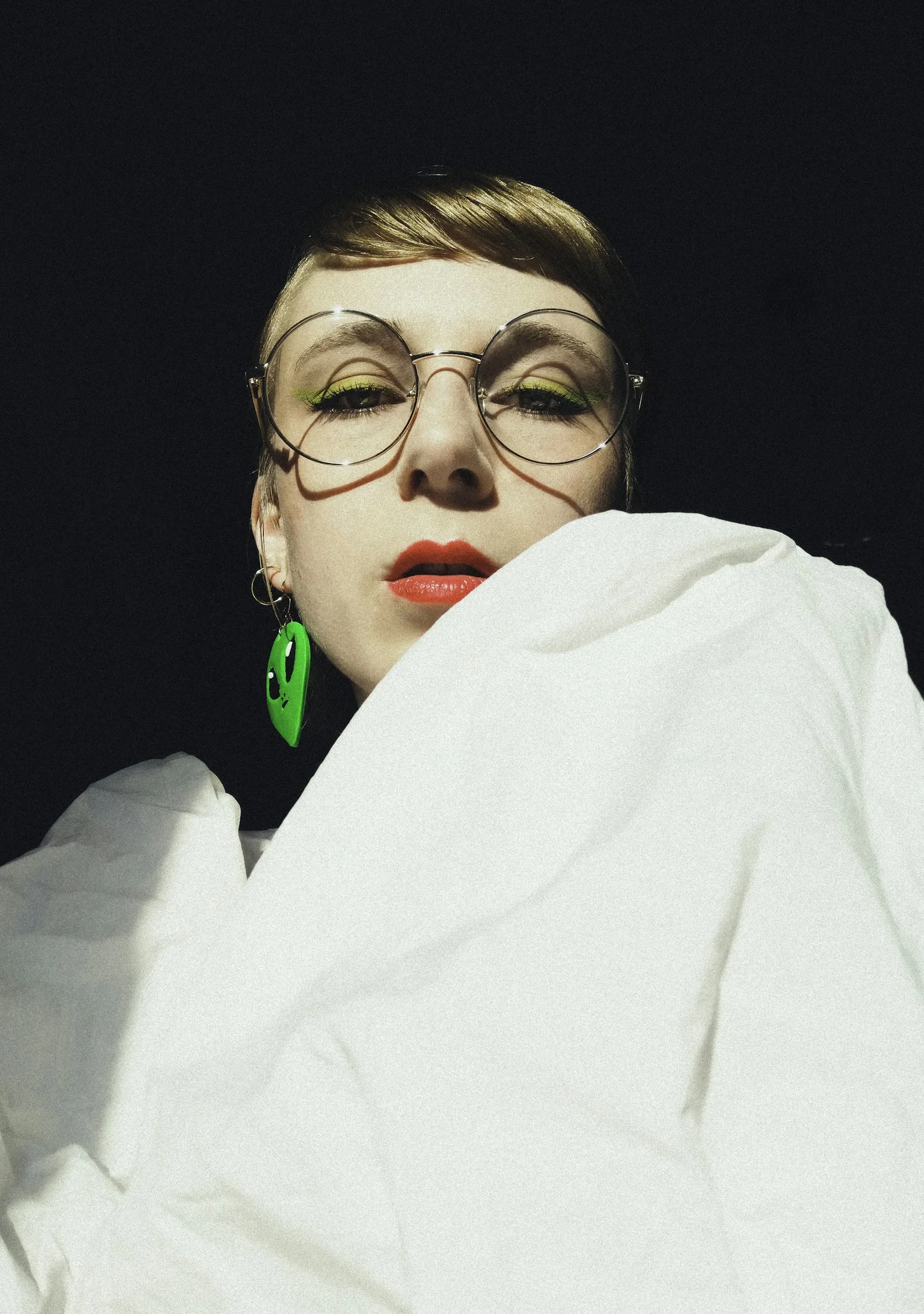 woman in white shirt wearing eyeglasses