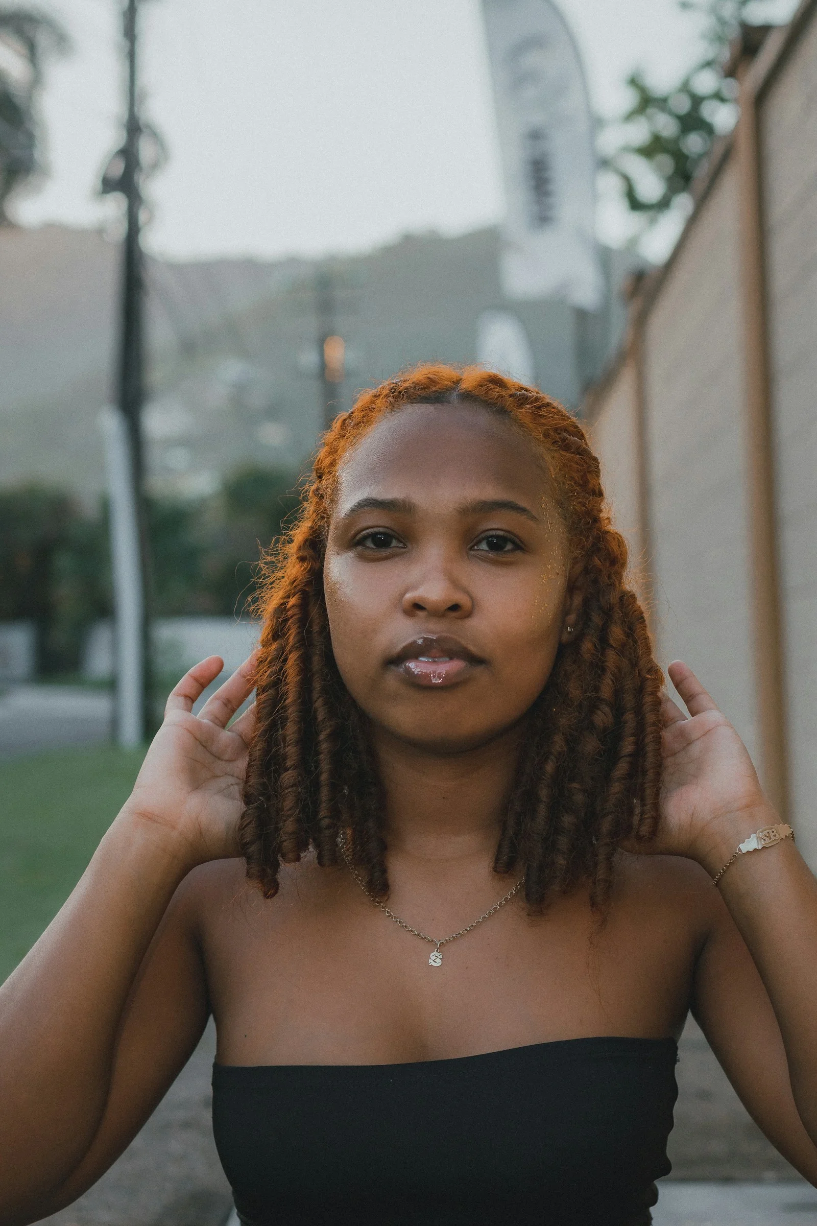 a woman with her hands on her head