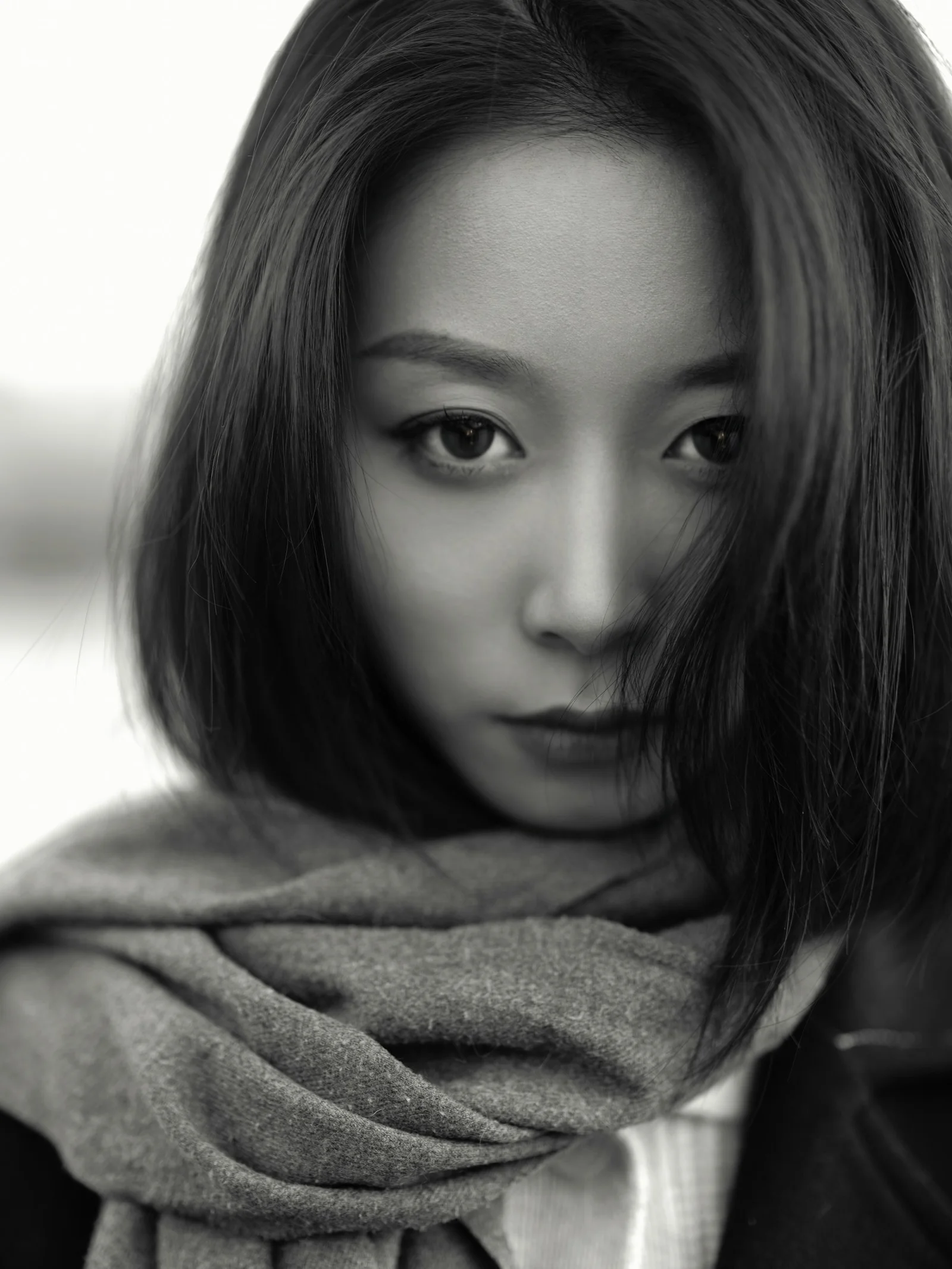 a woman with a scarf around her neck
