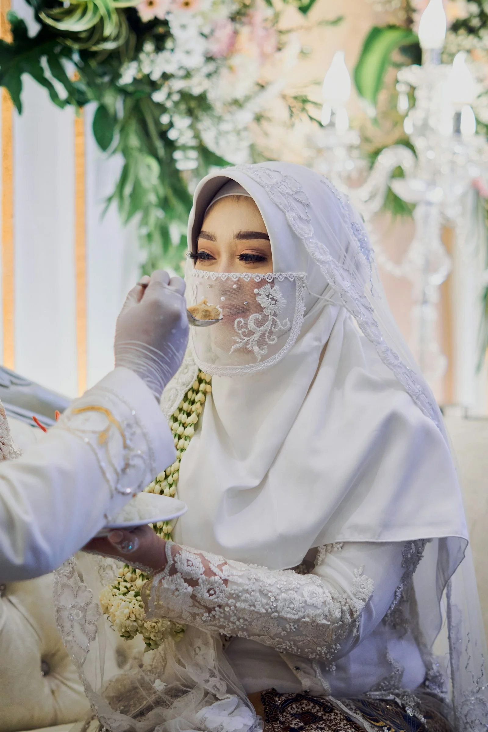 woman in white hijab and white long sleeve dress