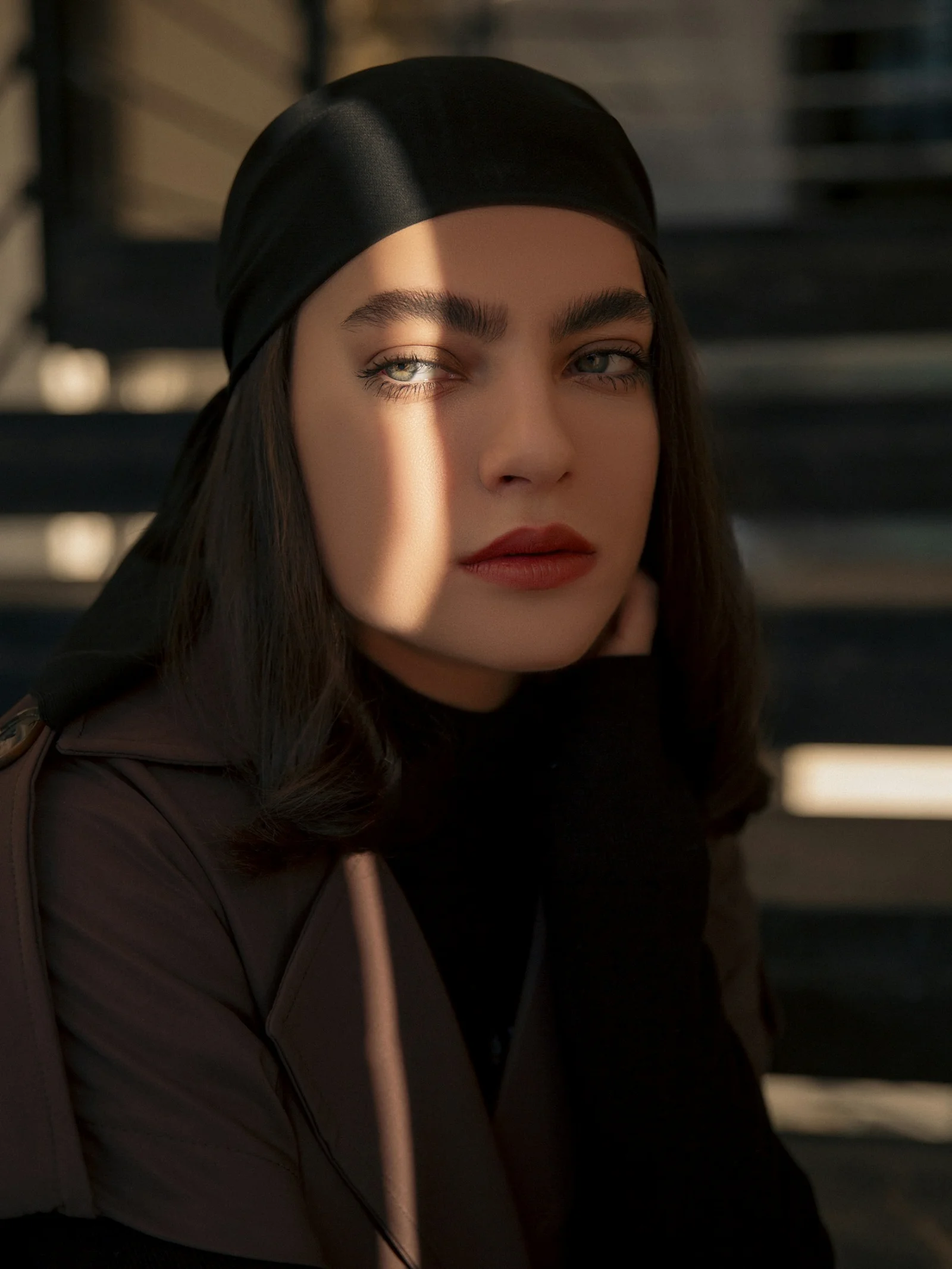 Woman with headscarf and dramatic lighting