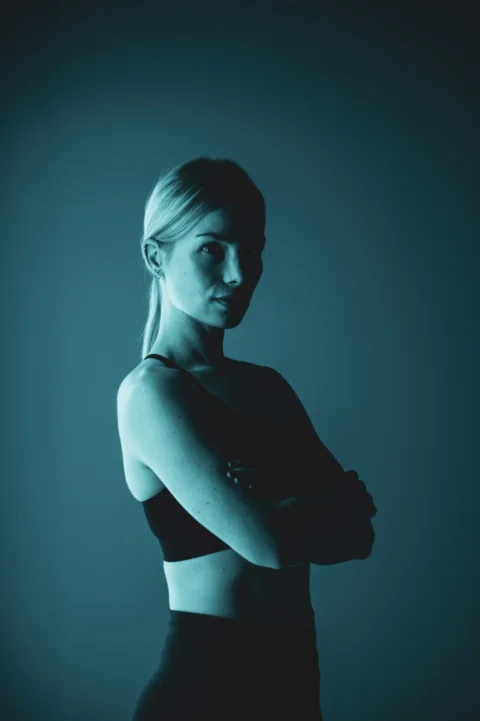 a woman standing in a dark room