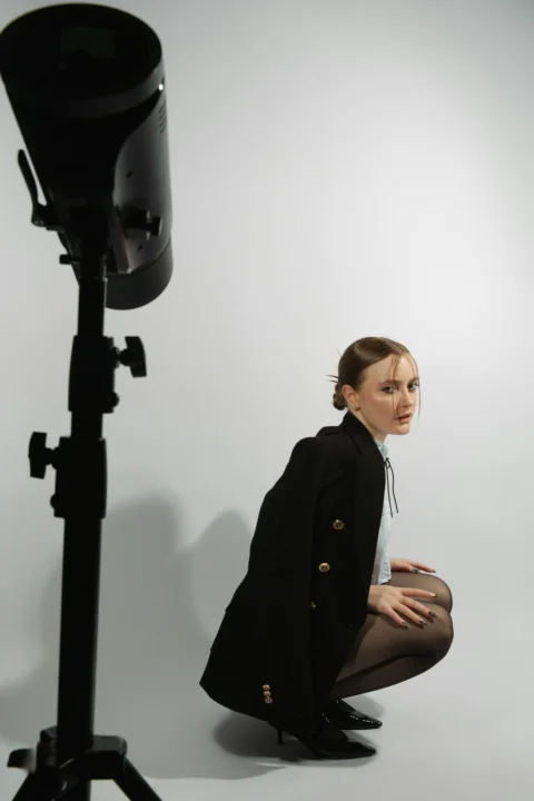 A woman poses for a photo shoot