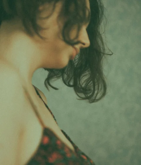 woman in black and red floral brassiere