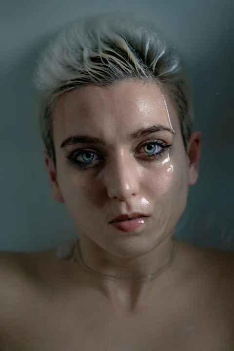 a woman with a white substance on her face