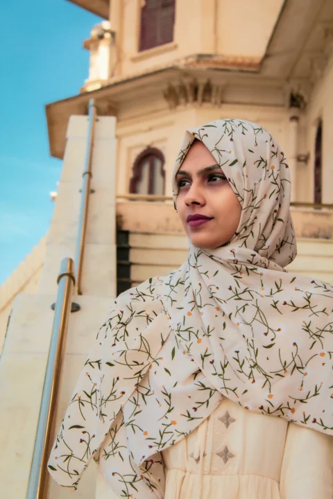 woman in white and black floral hijab