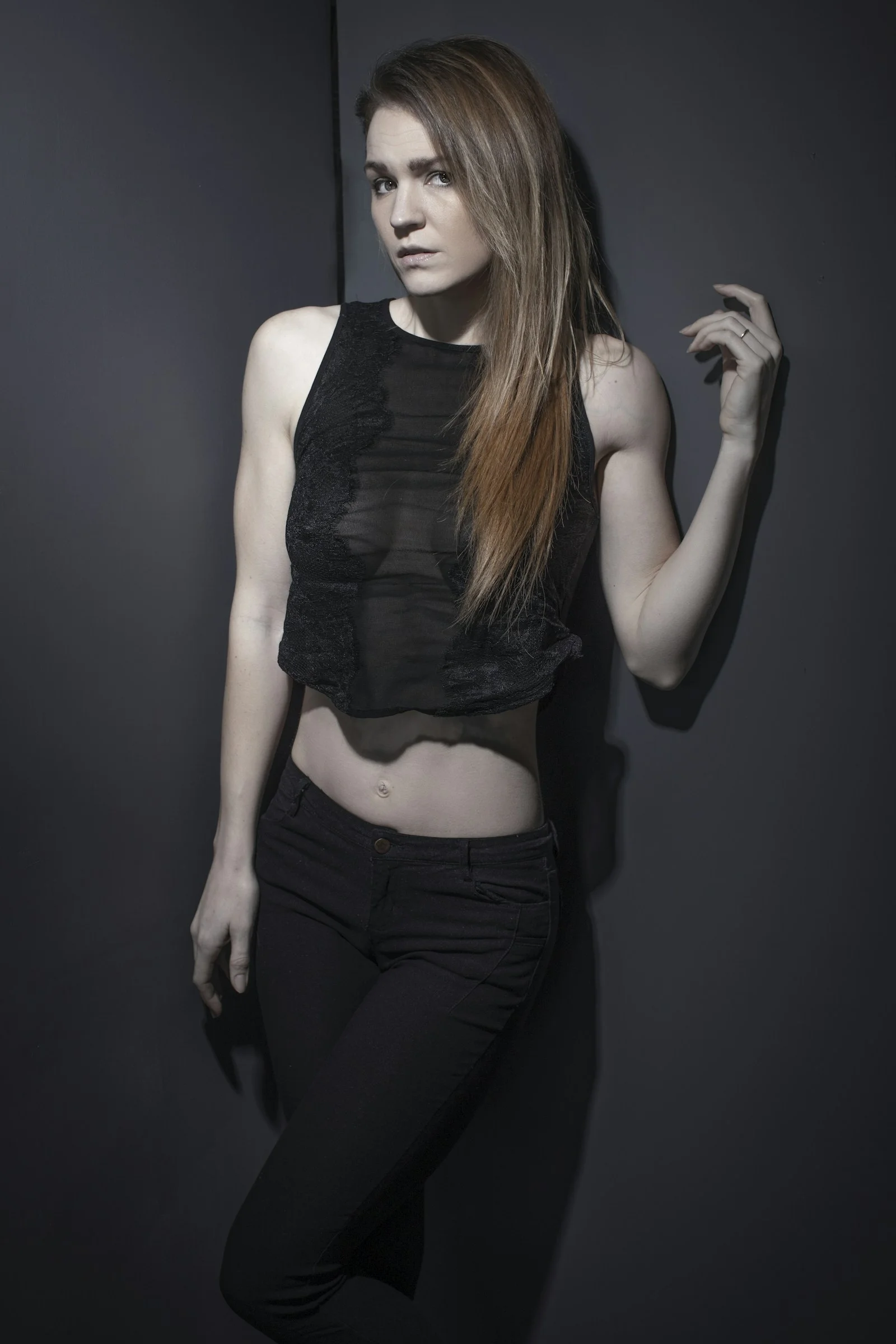 woman in black tank top and black denim jeans