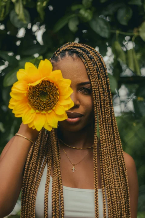 a woman with a flower in her hair