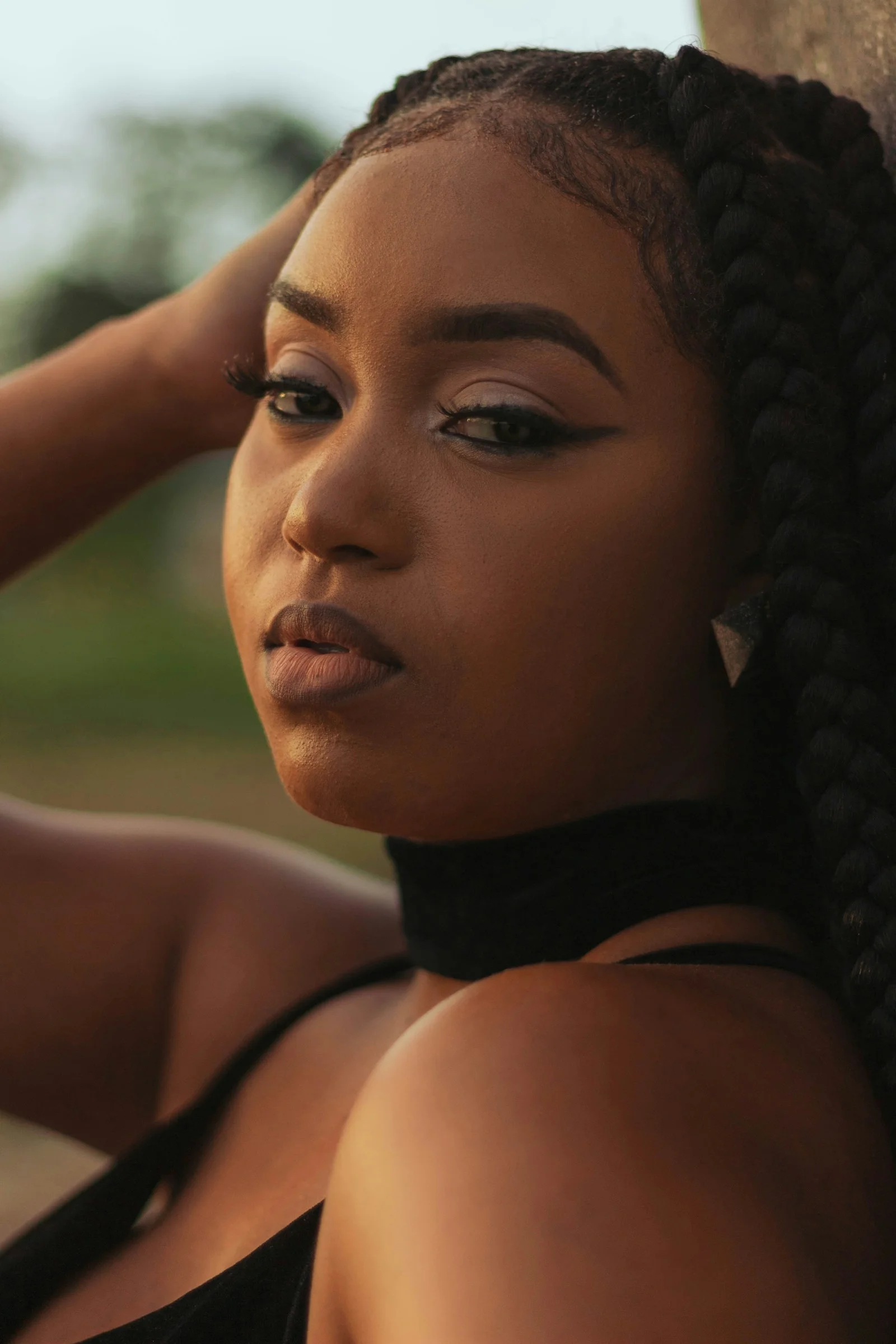 a close up of a person wearing a black dress