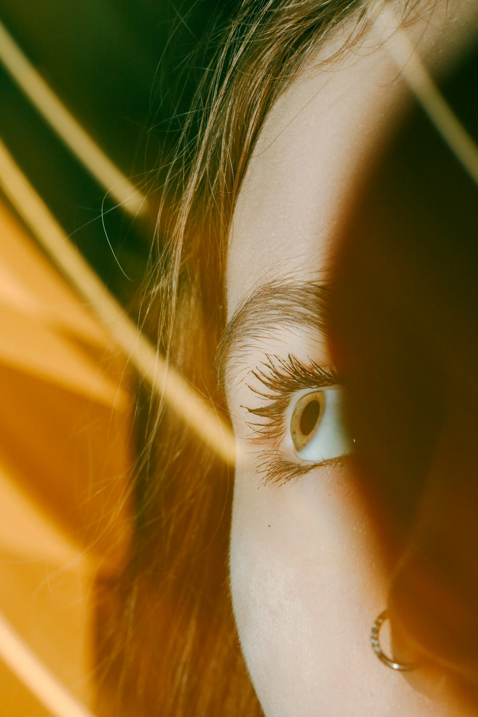 A close up of a person's eye with a blurry background