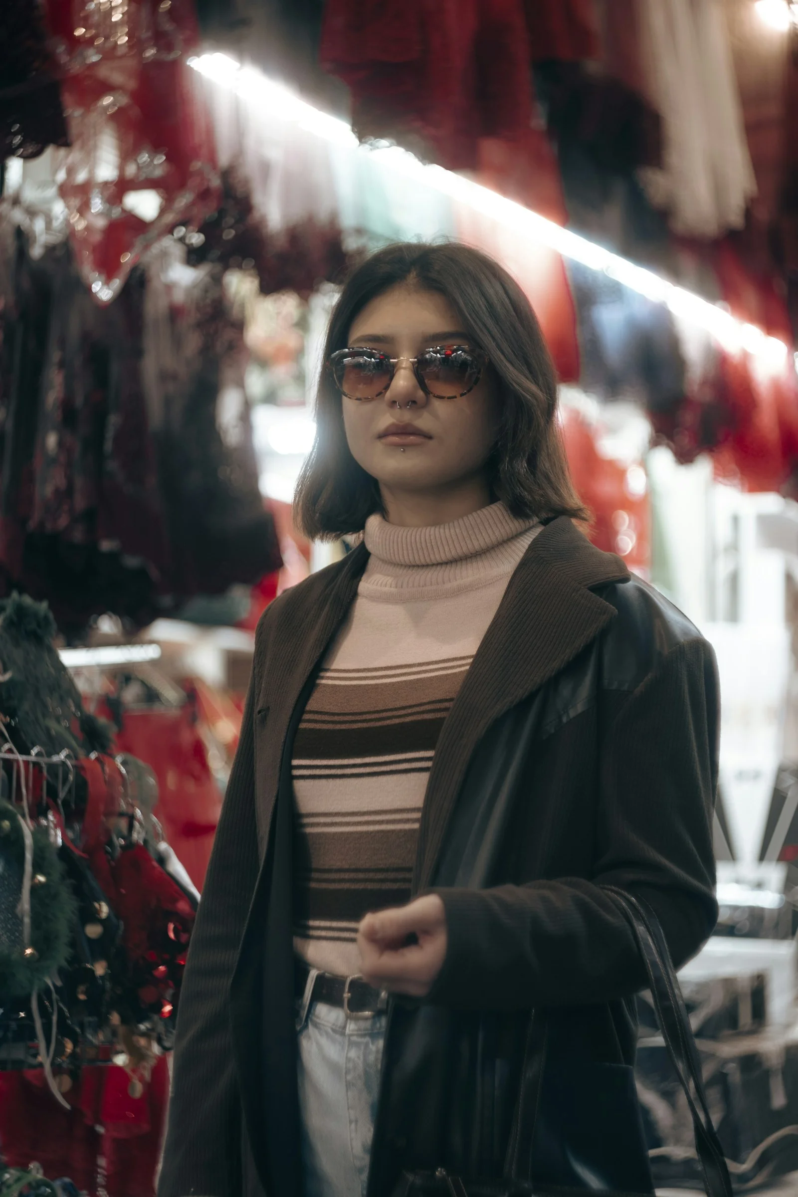 a woman standing in front of a christmas display