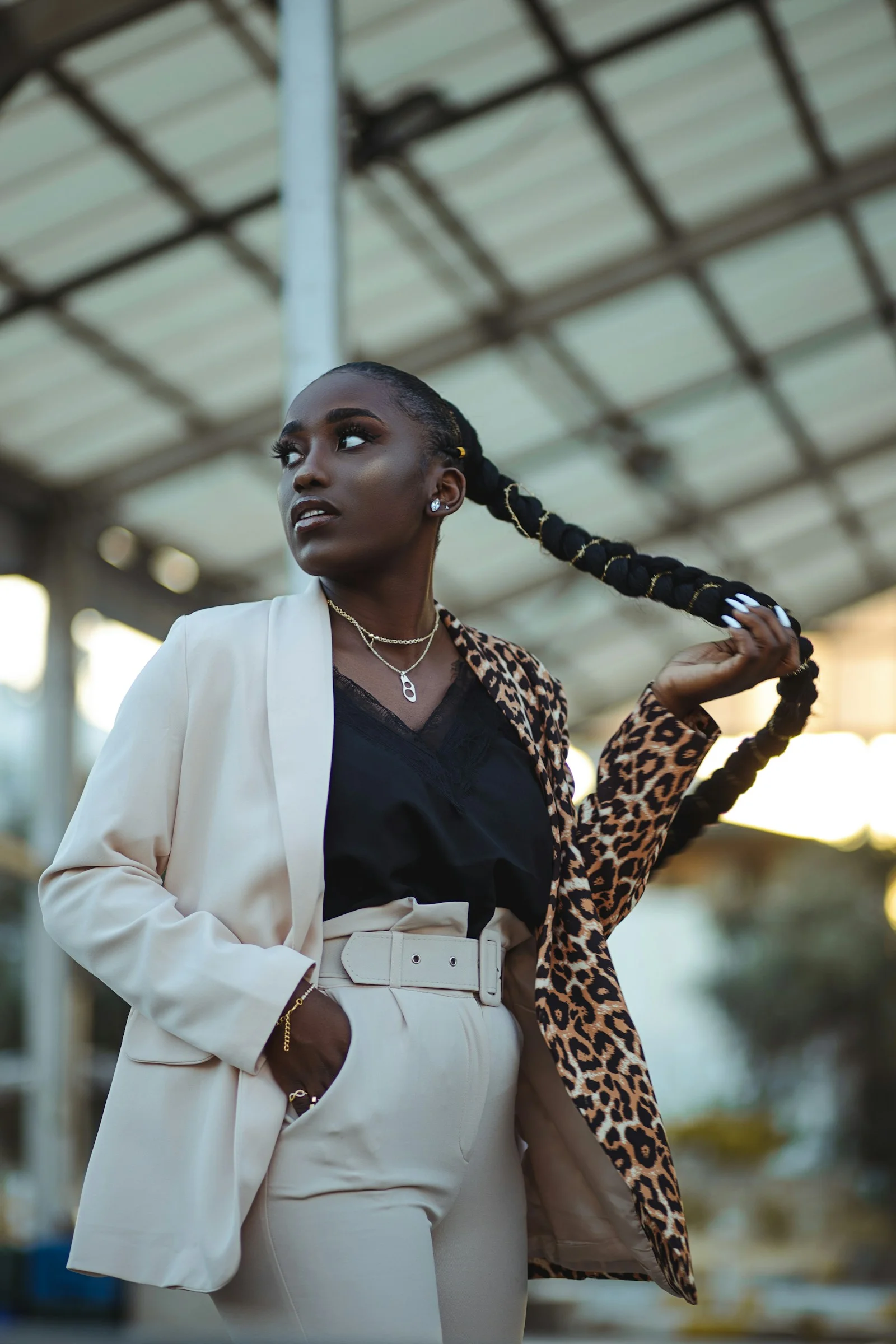 woman in white blazer standing