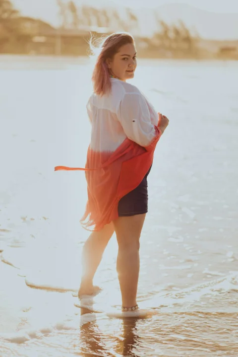 a person in a dress on a beach