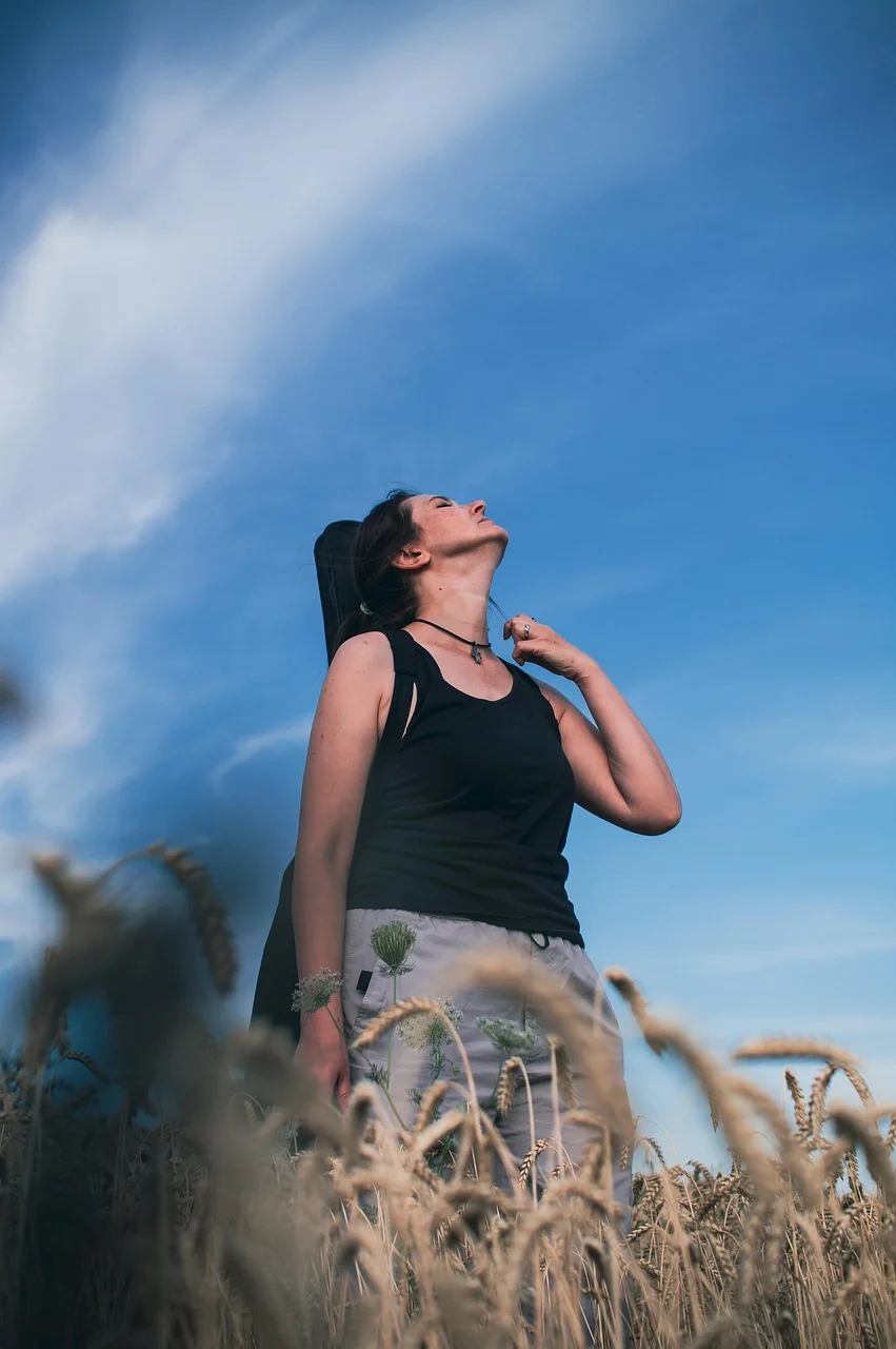 young woman, wheat field, sky, portrait
