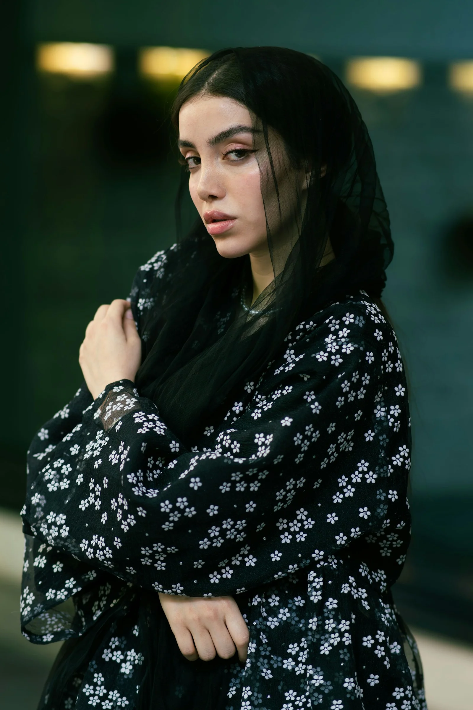 A woman poses in floral clothing