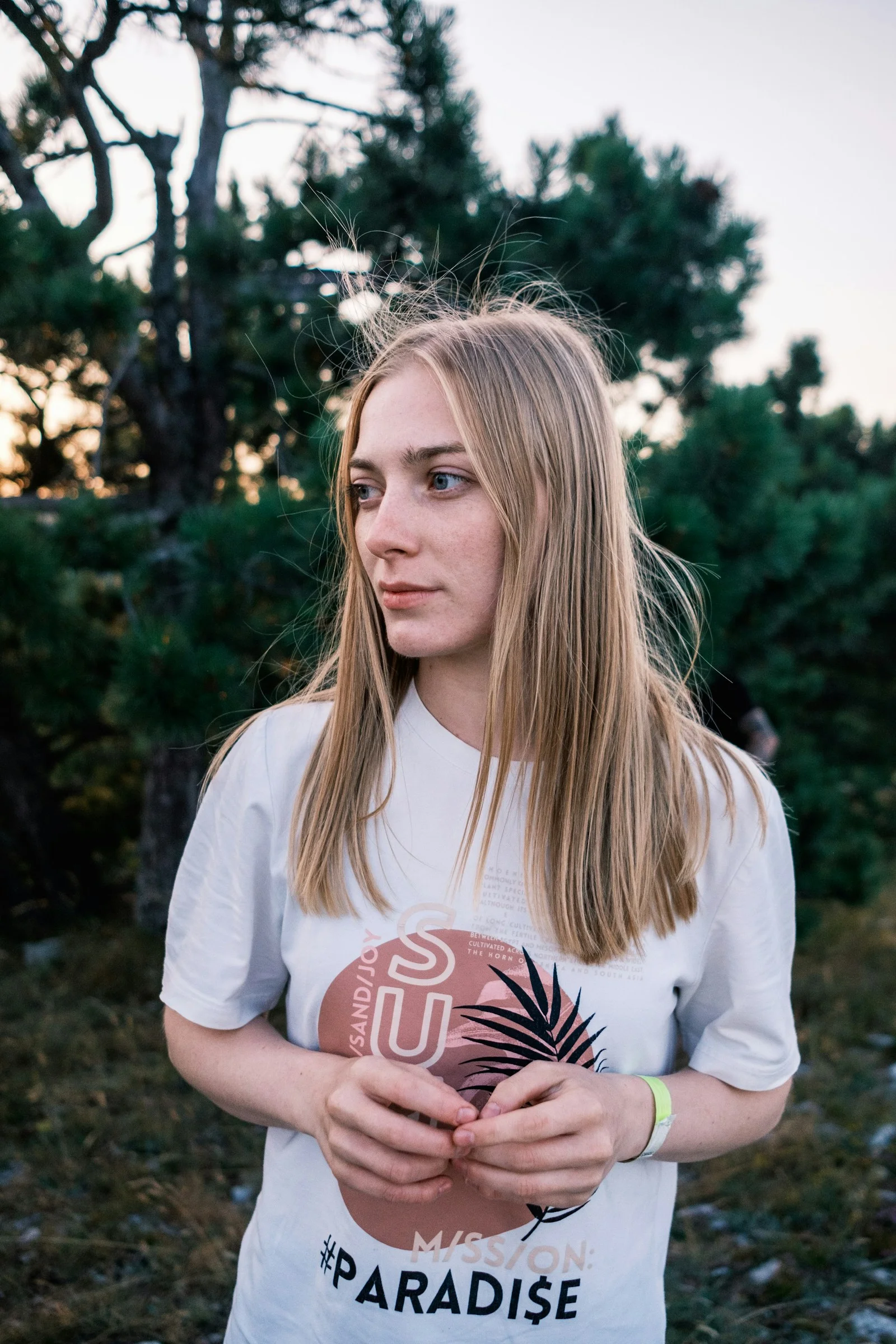a young woman holding a football in her hands