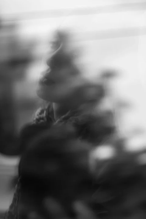 grayscale and closeup photo of woman