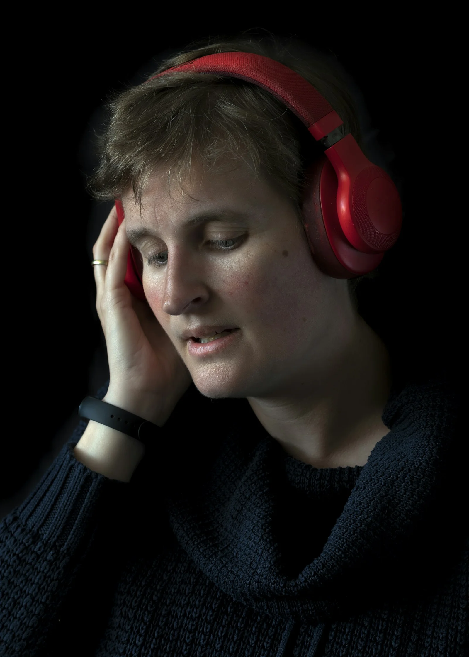 a woman with headphones on her ears