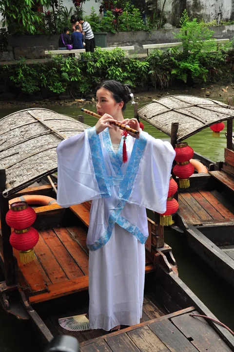 chinese woman, chinese woman with flute, chinese woman on boat