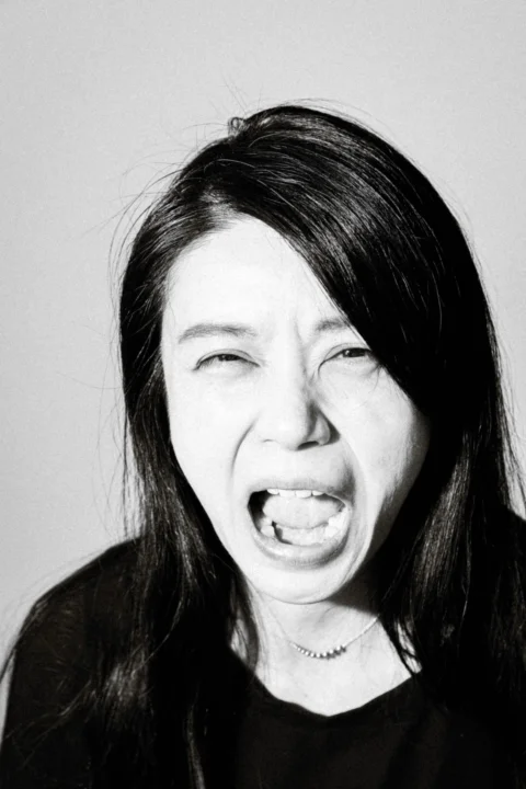 a woman making a face with her mouth open