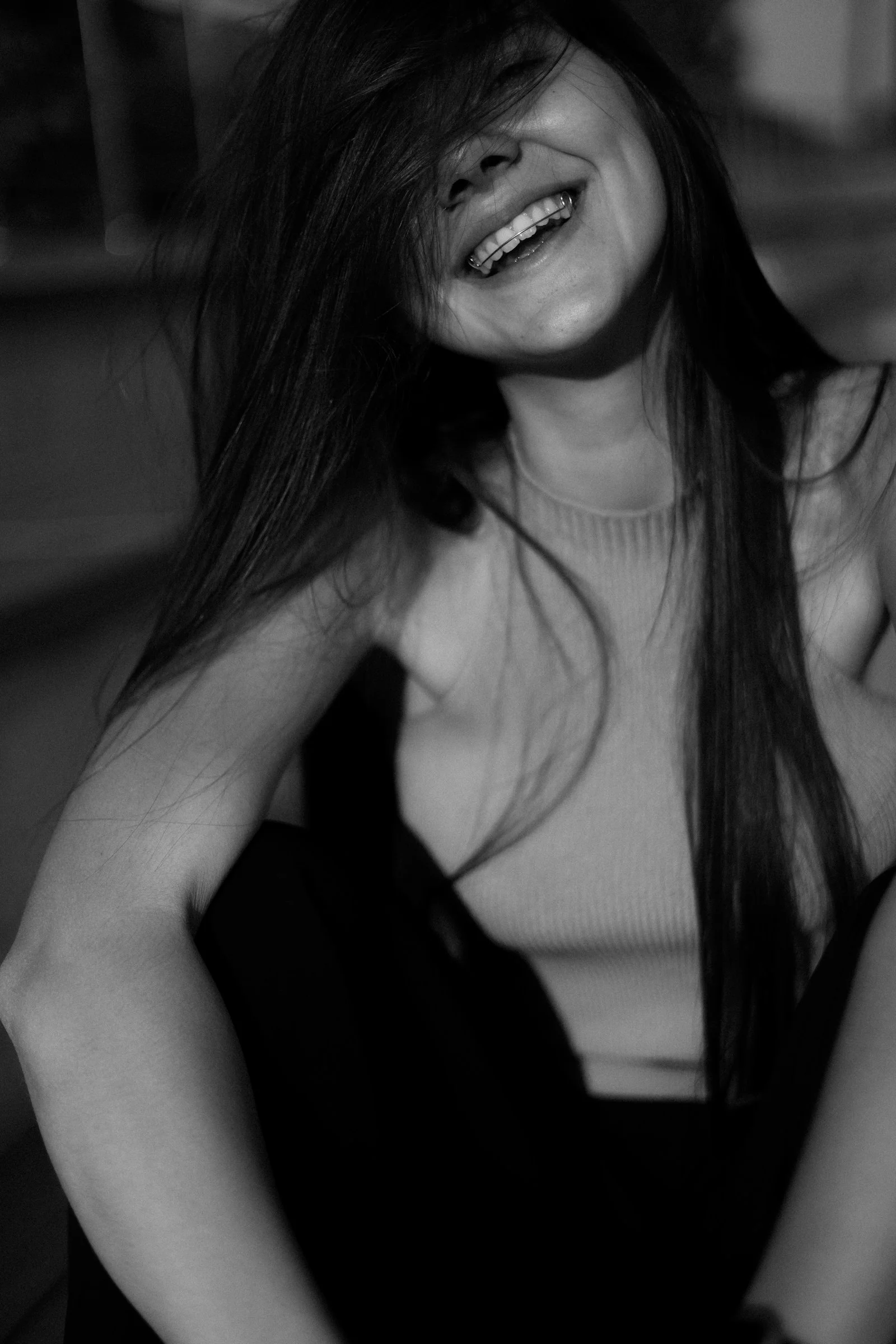 A smiling woman with long hair
