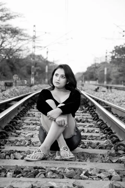 indian woman, outdoors, railroad, train track