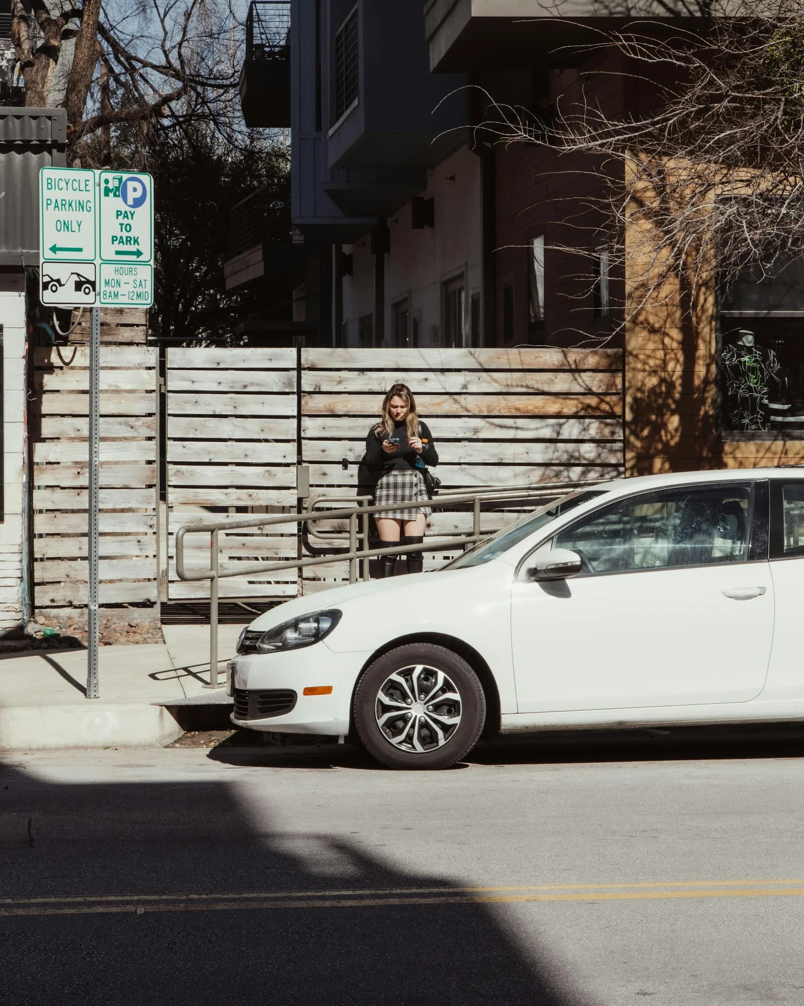 a white car parked on the side of the road
