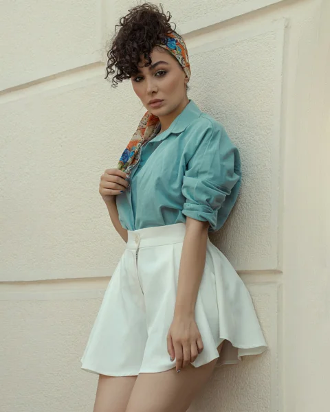 a young girl wearing a blue dress