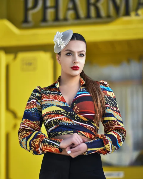 woman in white and red floral long sleeve shirt wearing white floral headband