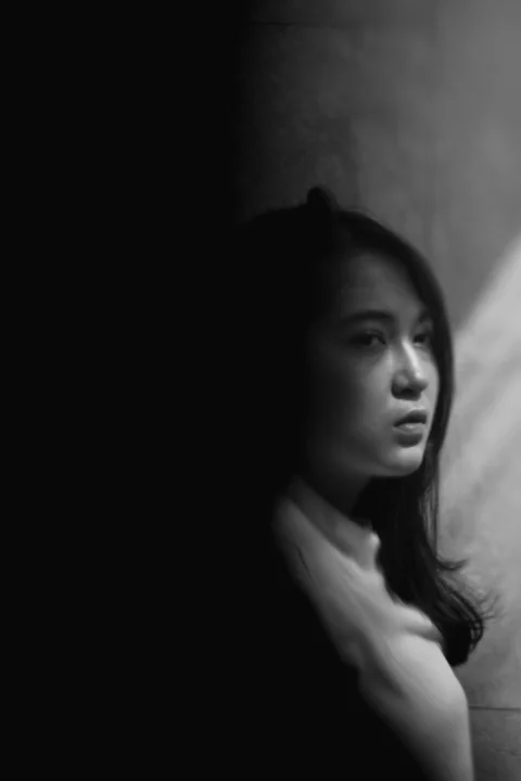 grayscale photo of woman in white shirt