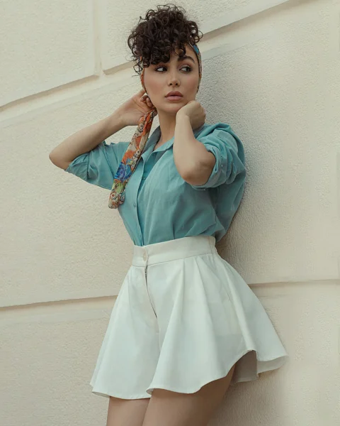a young girl talking on a cell phone