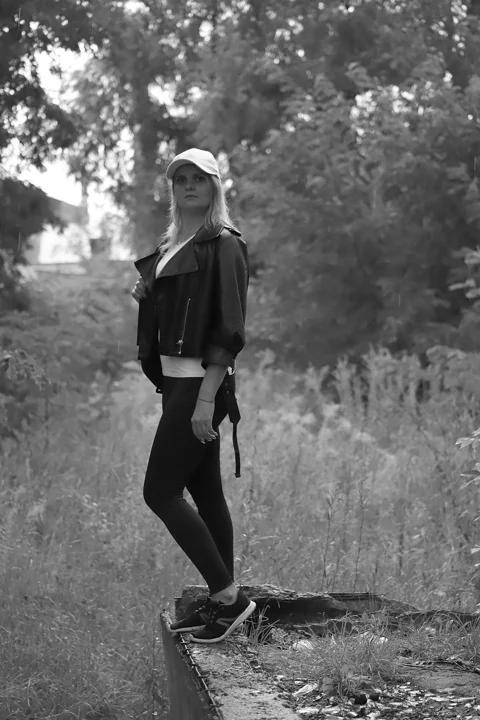 young woman, skate, brick, window