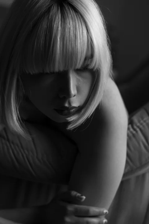 a black and white photo of a woman with blonde hair
