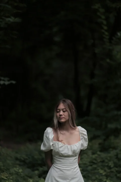 a person standing in a forest