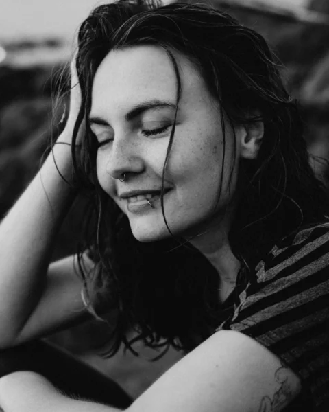 a woman with her eyes closed