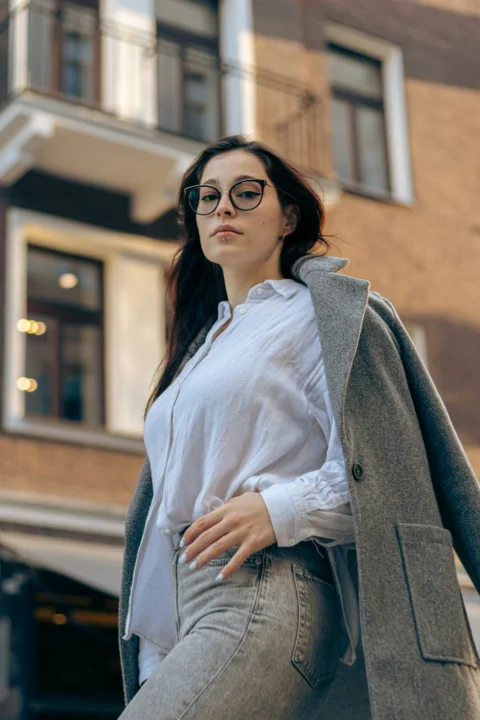 A confident woman poses in the city