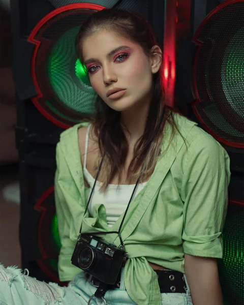 a woman in a green jacket