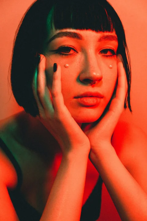 woman with black hair and red lipstick
