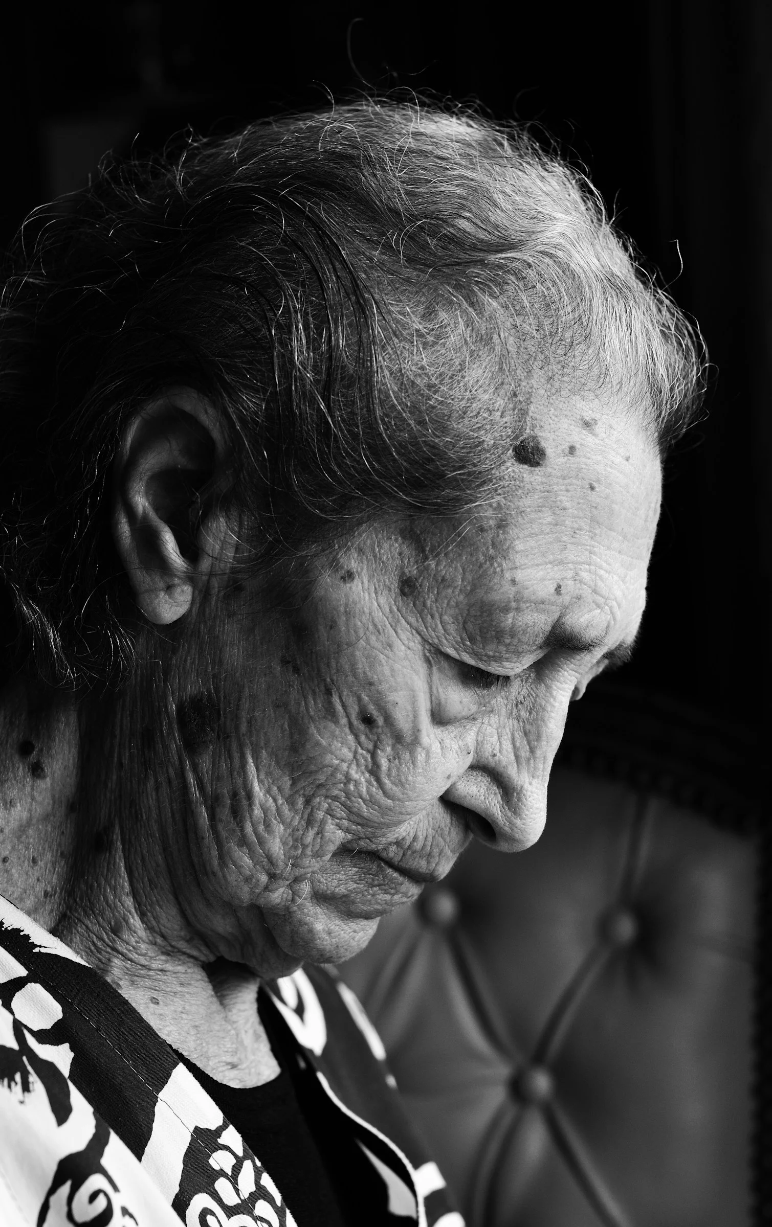 a black and white photo of an old woman